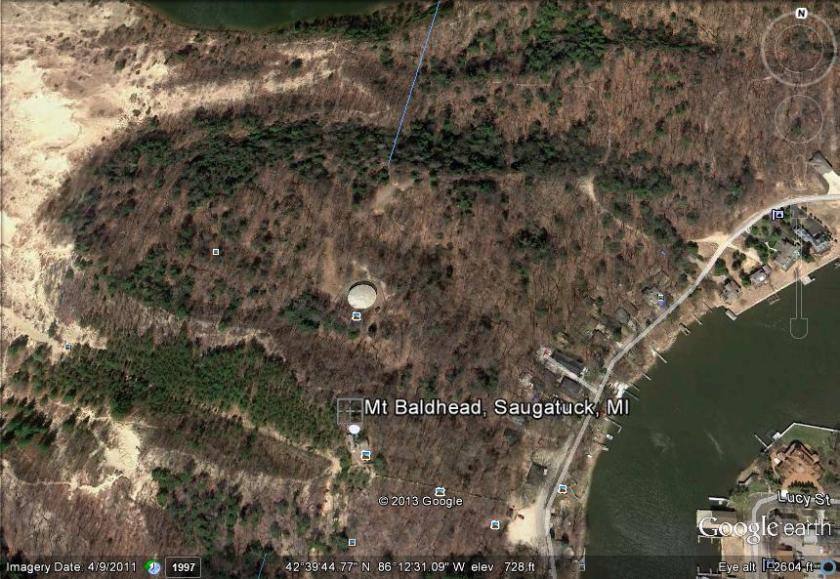 Mount Baldhead, Saugatuck, Michigan.  A clearer view of the damage is available in the article to which we provide a link.  We were denied permission to publish that picture.