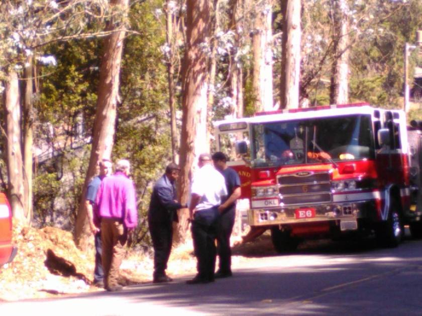 Fire truck called to hose down steaming pile of wood chips, September 3, 2015